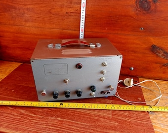 Vintage military low frequency amplifier from the Cold War. Army apparatus. Professional radio-electronic equipment. Military device.