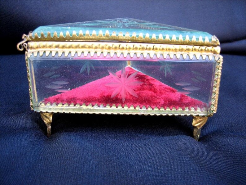 Antique French glass box for jewelry and small items from the early 20th century Collection of vintage jewelry boxes on the ladies/' table.