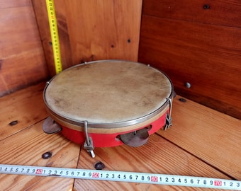 Vintage percussion musical instrument - tambourine. Ritual instrument. Music of shamans. Percussion instrument.