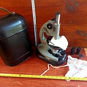 Vintage microscope in its original metal case from the mid-20th century from the USSR. Optical devices. Microscopes. Antique gift.