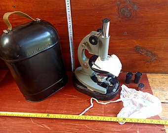 Vintage microscope in its original metal case from the mid-20th century from the USSR. Optical devices. Microscopes. Antique gift.