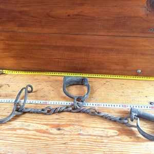 Antique forged shackles of the 19th centuries. Horse leg shackles. Prison shackles on the legs. Prison handcuffs. Handcuffs.