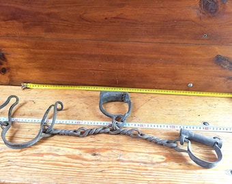 Antique forged shackles of the 19th centuries. Horse leg shackles. Prison shackles on the legs. Prison handcuffs. Handcuffs.
