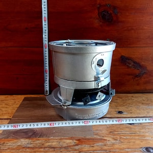 Vintage mid-20th century three burner kerosene stove for open fire cooking. Historical artifact. Antique gift. Tourist stove.