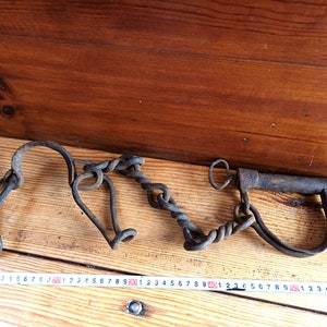 Antique forged shackles of the 18th-19th centuries. Horse leg shackles. Prison shackles on the legs. Prison handcuffs. Handcuffs.