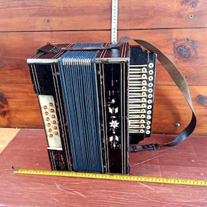 Musical folk instruments. Antique gift. Russian accordion. Vintage musical instrument - accordion from the 40 of the 20th century.