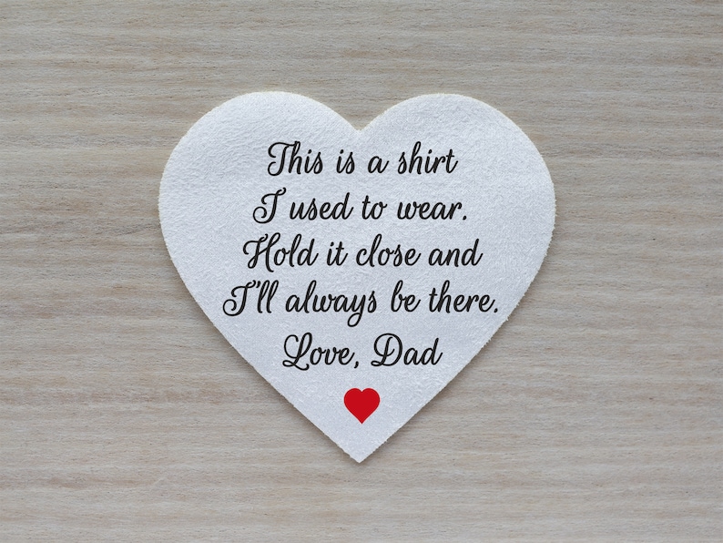 May include: A white heart-shaped fabric patch with the text "This is a shirt I used to wear. Hold it close and I'll always be there. Love, Dad." A small red heart is at the bottom.