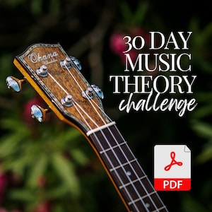 May include: A close-up of the headstock of a ukulele with the brand name "Ohana Ukuleles" printed on it. The ukulele is in focus, and the background is blurred. The text "30 DAY MUSIC THEORY challenge" is in white text on a dark green background. A red PDF icon is in the lower right corner of the image.