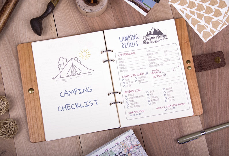 May include: A brown leather-bound notebook with a camping checklist and details on the inside pages. The checklist includes items like tent, sleeping bag, food, and water. The details page includes space for campground name, dates, amenities, and a star rating.