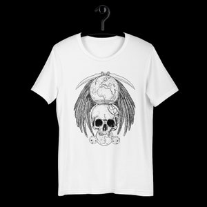 May include: White t-shirt with a black and white graphic print of a skull with wings, a scythe, and a globe.
