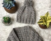 Grey pom-pom scarf and cap for baby and child. Baby scarf. Baby hat. Model boy. Children 39 s scarf and hat.