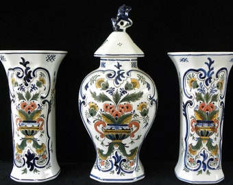 Royal Delft polychrome (1976/ 1977) handpainted three-piece kaststel: two beaker vases and covered pul (Porceleyne Fles)