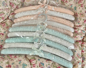 Pretty new old stock set of 5 and  6!! Vintage shabby chic runched satin hangers with small ivory ribbons Saks or farmhouse 100% cotton