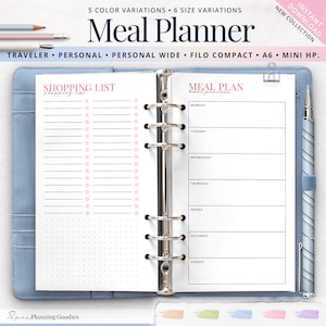 May include: A blue and white planner with a meal plan and shopping list on the pages. The planner is open and has a silver binder. The text on the planner says "Meal Planner" and "Meal Plan".