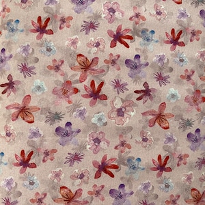 May include: A pink fabric with a floral pattern. The flowers are in shades of pink, red, and purple. The fabric has a subtle texture.