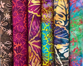 May include: Six different fabric swatches with colourful batik patterns. The fabrics feature floral, leaf, and geometric designs in shades of brown, orange, pink, purple, blue, and green.