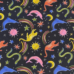 May include: A black fabric with a colourful repeating pattern of dolphins, snakes, rainbows, stars, moons, and suns. The pattern is a whimsical and playful design.