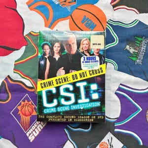 May include: A set of three ceramic mugs with a speckled, matte finish. The mugs are in shades of cream, light gray, and dark gray. Each mug has a simple, minimalist design, perfect for coffee or tea.