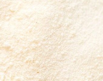 May include: Close-up of a fine, white powder. The powder is smooth and evenly textured.