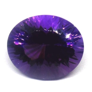 May include: A faceted, round amethyst gemstone. The gem is a deep purple color with a dark center and lighter, reflective facets. The stone is set against a white background, highlighting its color and cut.