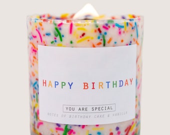 May include: A white candle with a colorful sprinkle design and a label that reads "Happy Birthday" and "You are special. Notes of birthday cake & vanilla."