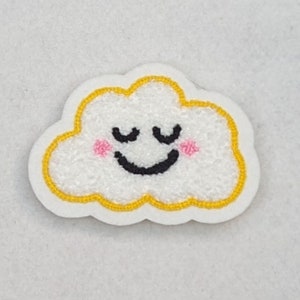 May include: A white cloud with a yellow outline and a smiling face with closed eyes. The cloud has pink cheeks.