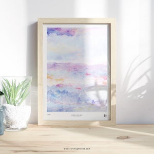 May include: A framed watercolor painting of a colorful landscape with a light blue sky, pink and purple clouds, and blue mountains. The painting is titled "Close and See" and is signed by the artist.