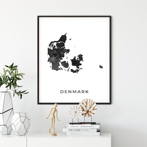 May include: Black and white watercolor print of the outline of Denmark with the word "DENMARK" printed below the map.