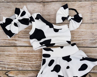 Cow Print Baby Outfit: One Shoulder Crop Top, Skirted Bummie, Headwrap