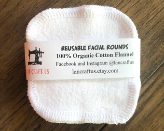 May include: Reusable white cotton facial rounds made from 100% organic cotton flannel. The rounds are stacked on top of each other and have a label that reads "Reusable Facial Rounds 100% Organic Cotton Flannel Facebook and Instagram @lancraftus lancraftus.etsy.com"