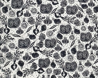 May include: Black and white fabric with a repeating pattern of vegetables, onions, and other botanical elements. The fabric has a white background and black print.
