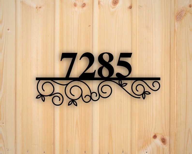 May include: Black metal house number plaque with the number 7285 and a decorative scroll design.