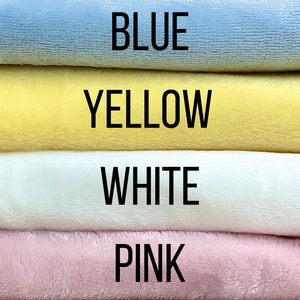 May include: Four fabric swatches stacked on top of each other. The top swatch is blue, the second is yellow, the third is white, and the bottom swatch is pink.