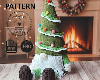 May include: A knitted Christmas tree gnome with a green tree-shaped hat decorated with colorful pom-poms and white trim. The gnome has a long white beard, brown feet, and green arms. The image includes the text "KNITTING PATTERN" and "CREATIVE HOUSE PATTERN".