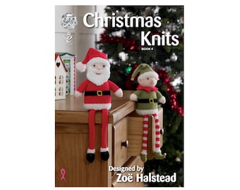 May include: A book titled "Christmas Knits" with a red and white Santa Claus and a green elf sitting on a wooden surface. The book is designed by Zoë Halstead.