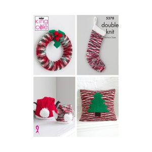May include: A set of four Christmas knitting patterns featuring a wreath, stocking, pillow with a Christmas tree design, and a teapot and mug cozy. The patterns are from King Cole and are double knit.