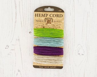 May include: A package of hemp cord in four colors: green, light blue, purple, and natural. The package is labeled "Hemp Cord" and "Premium Quality" with the brand name "Hannutique". The package includes 4 x 29.8 feet of cord.