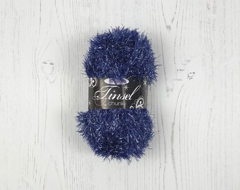 May include: A ball of blue yarn with silver tinsel threads. The yarn is labeled "Tinsel Chunky".