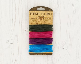 May include: A package of hemp cord in four colors: dark green, pink, purple, and blue. The package is labeled "Hemp Cord" and "Hemptique" with the text "4x29.8FT" and "40.1M".