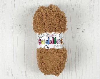 May include: A ball of King Cole Cuddles Chunky yarn in a brown color. The yarn is a fluffy, soft texture.