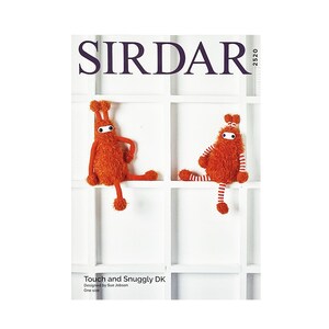 May include: A knitting pattern booklet from Sirdar featuring two orange and white crocheted monsters. The pattern is called "Touch and Snuggly DK" and is designed by Sue Jacobson. The booklet is labeled with the number 2520.