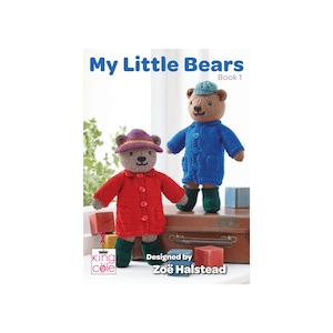 May include: A knitting pattern book titled "My Little Bears, Book 1" featuring two knitted teddy bears wearing raincoats and hats. The book is designed by Zoë Halstead.