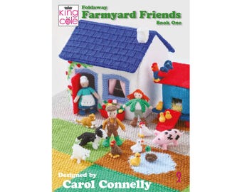 May include: A King Cole Foldaway Farmyard Friends Book One pattern book featuring a knitted white house with a blue roof, a red barn, and various knitted figures including people, a dog, a cat, a pig, chickens, and ducks on a colorful mat.