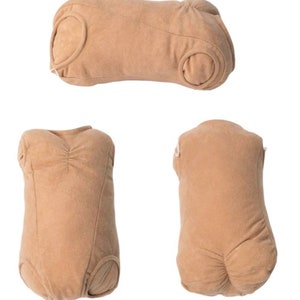 May include: Three brown fabric doll body parts for a reborn doll. The body parts include the torso, legs, and arms. The fabric is soft and plush.