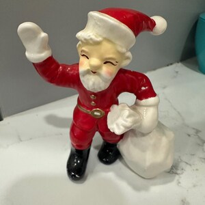 Figura de Papá Noel con bolsa