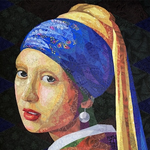 May include: A fabric art piece depicting the famous "Girl with a Pearl Earring" painting. The portrait features a woman with a blue and yellow headscarf, a pearl earring, and red lips. The background is dark with a geometric pattern.