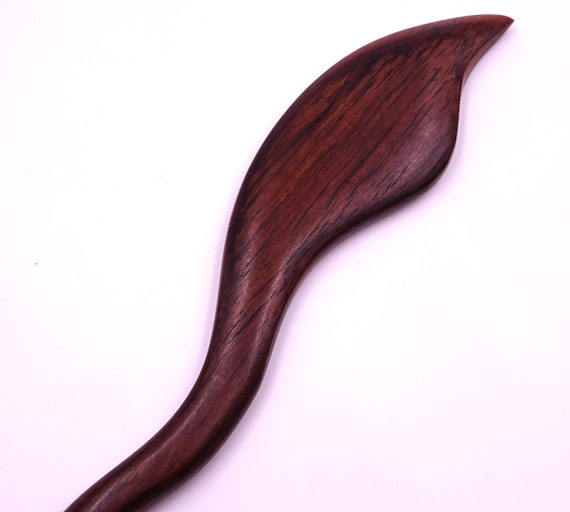 Wood-haired pic baguette bun sculpted handcrafted hairstyle