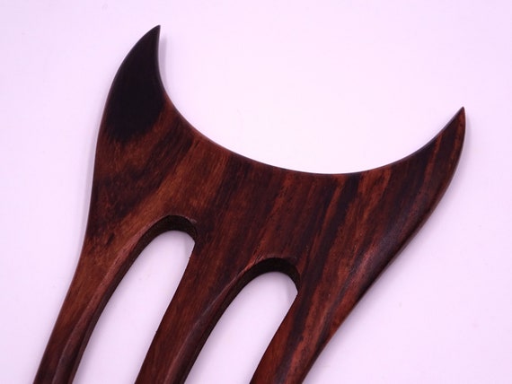 Wood-haired pic baguette bun sculpted handcrafted hairstyle