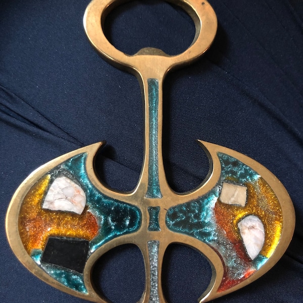 Vintage Minoan Labyris brass and enamel bottle opener.