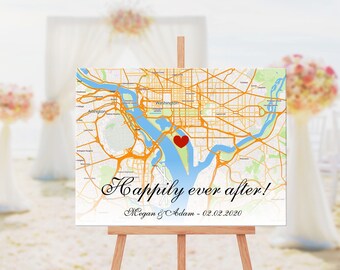 May include: A wedding sign with a map of Washington D.C. with a red heart marking the location. The sign reads "Happily ever after! Megan & Adam - 02.02.2020".